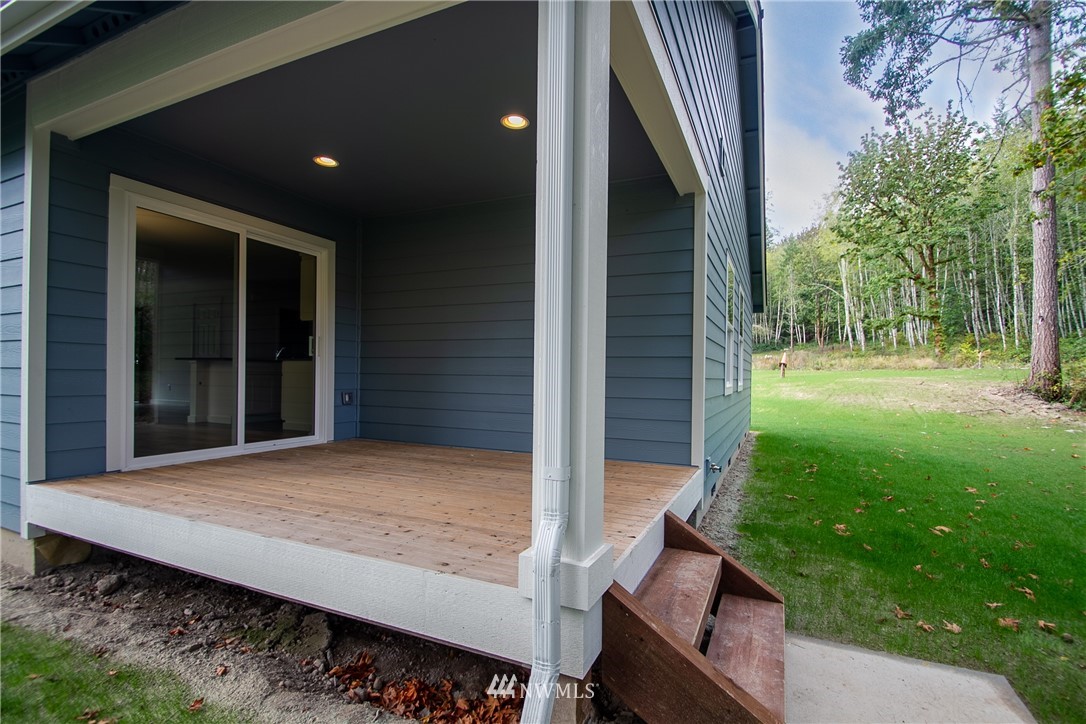 16716 Erickson Road Southwest Longbranch, WA 98351 - Photo 14 of 17 a view of backyard with patio