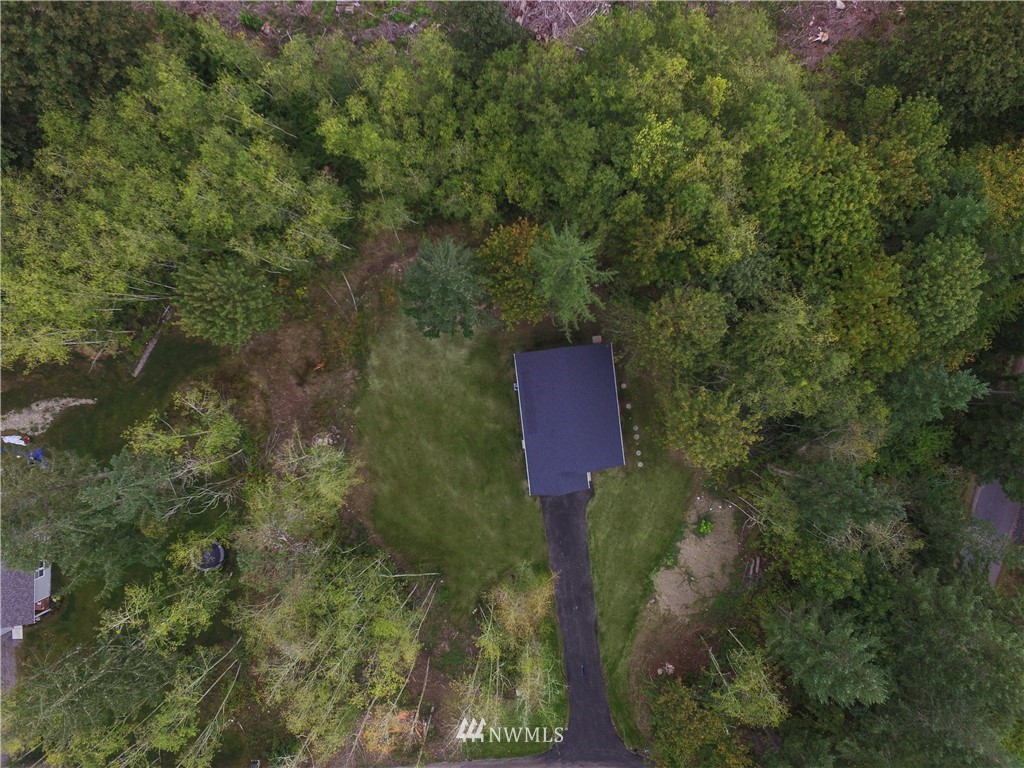 16716 Erickson Road Southwest Longbranch, WA 98351 - Photo 16 of 17 a view of a house with a yard