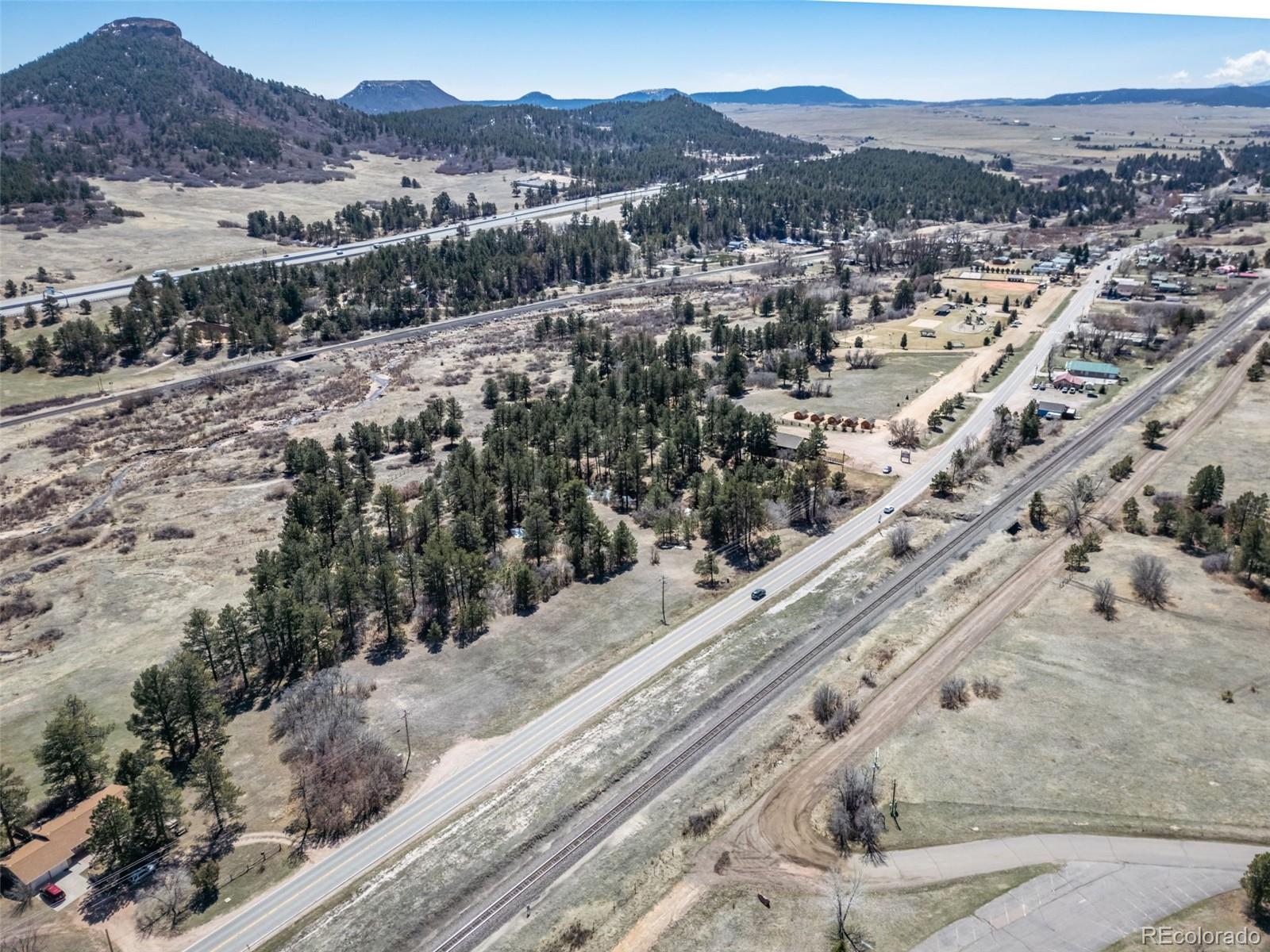 8650 Spruce Mountain Road Larkspur, CO 80118 - Photo 5 of 12 a view of a city with a mountain