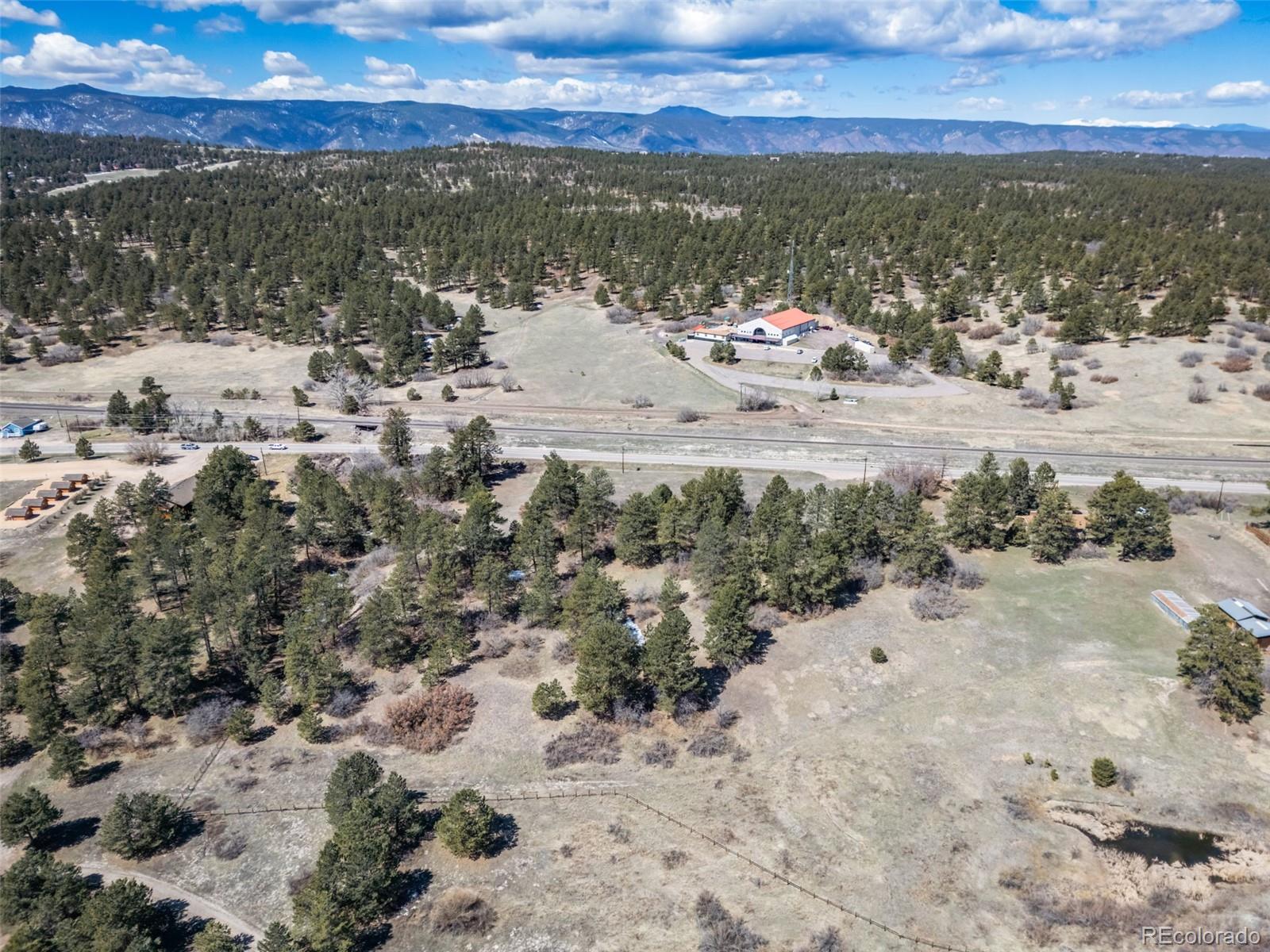 8650 Spruce Mountain Road Larkspur, CO 80118 - Photo 8 of 12 a view of lake view and mountain view