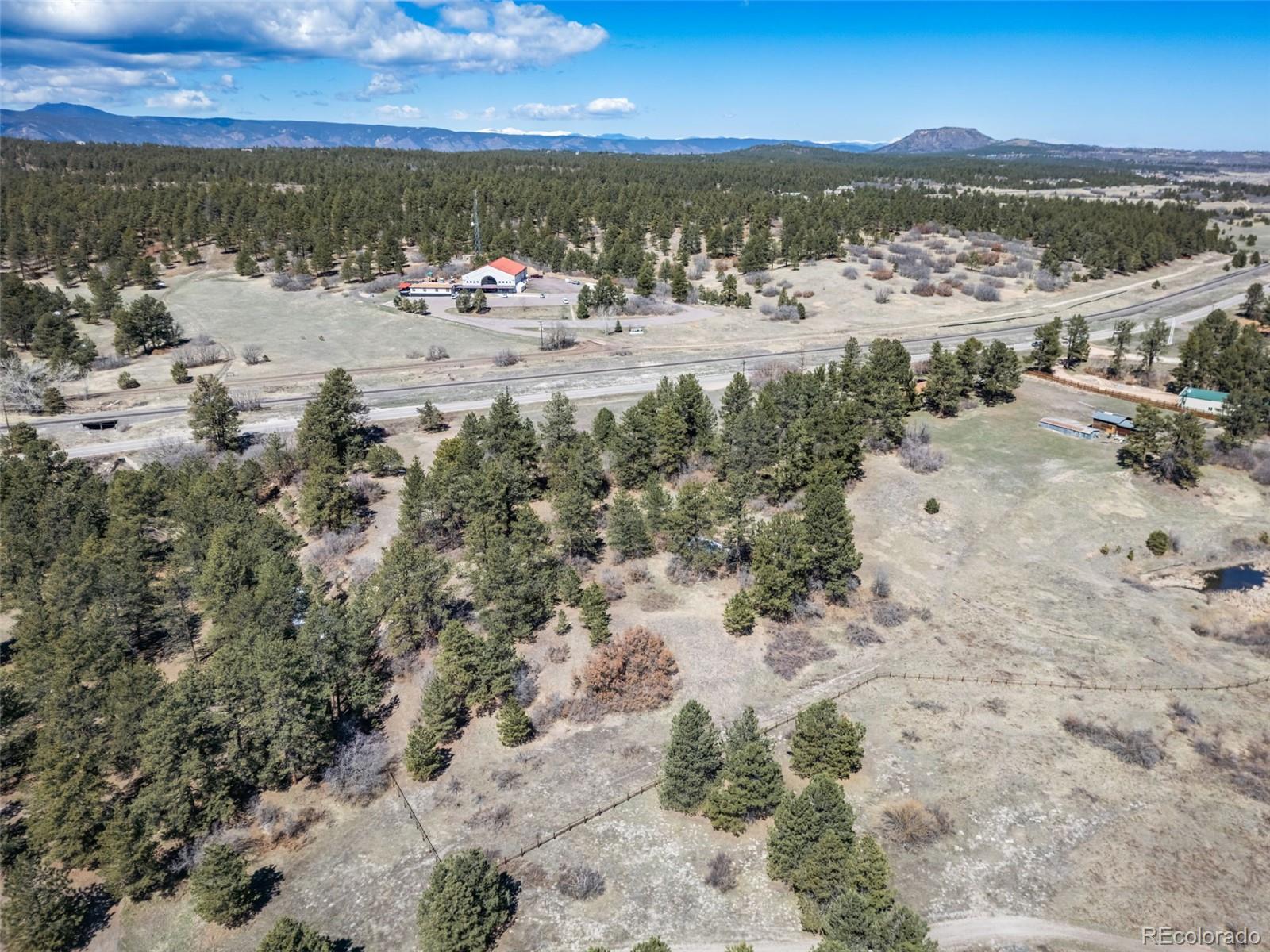 8650 Spruce Mountain Road Larkspur, CO 80118 - Photo 9 of 12 a view of lake view and mountain view