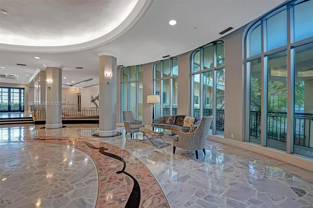 a outdoor space with lots of furniture and glass windows