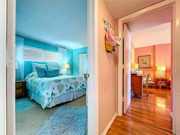 a bedroom with a bed and a table