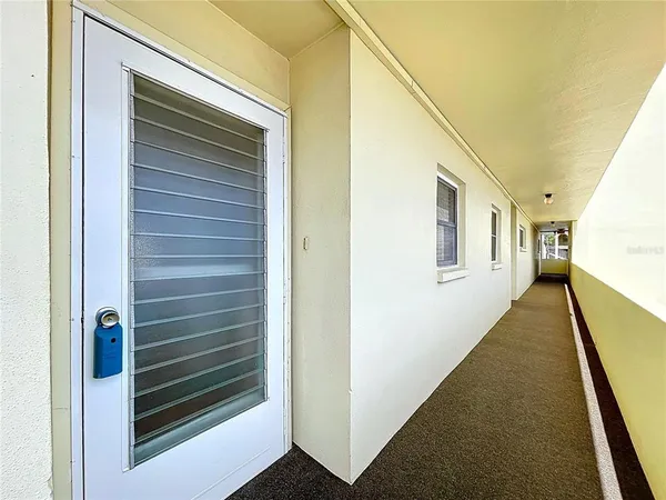 a view of a hallway with the wooden walls