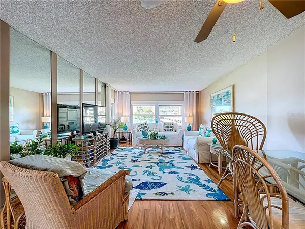 a living room with furniture fireplace and a table