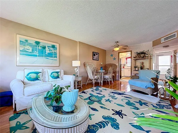 a living room with furniture and a rug