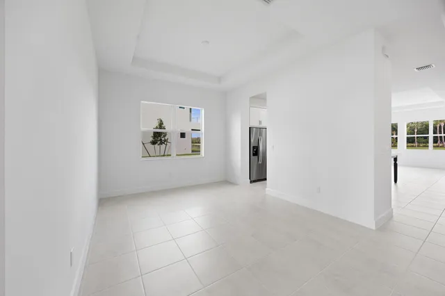 a kitchen with stainless steel appliances a sink a stove and a refrigerator