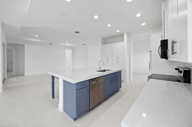 a bedroom with a bed and large window