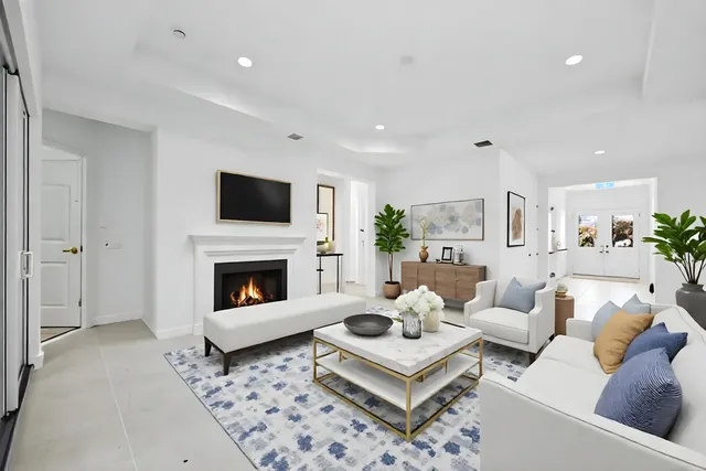 a spacious bedroom with a bed and a couch