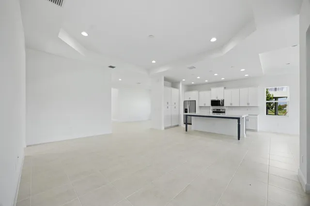 a bathroom with a sink a toilet a mirror and shower