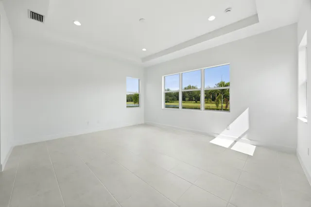 a bedroom with furniture and a chandelier