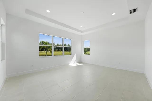 a bathroom with a granite countertop sink a toilet a mirror and shower
