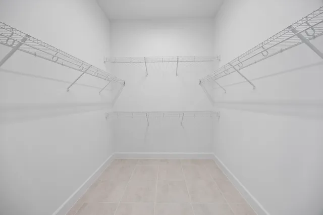 a view of storage and utility room with cabinets