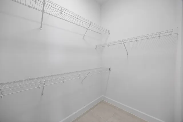 a view of a patio with couches and a potted plant