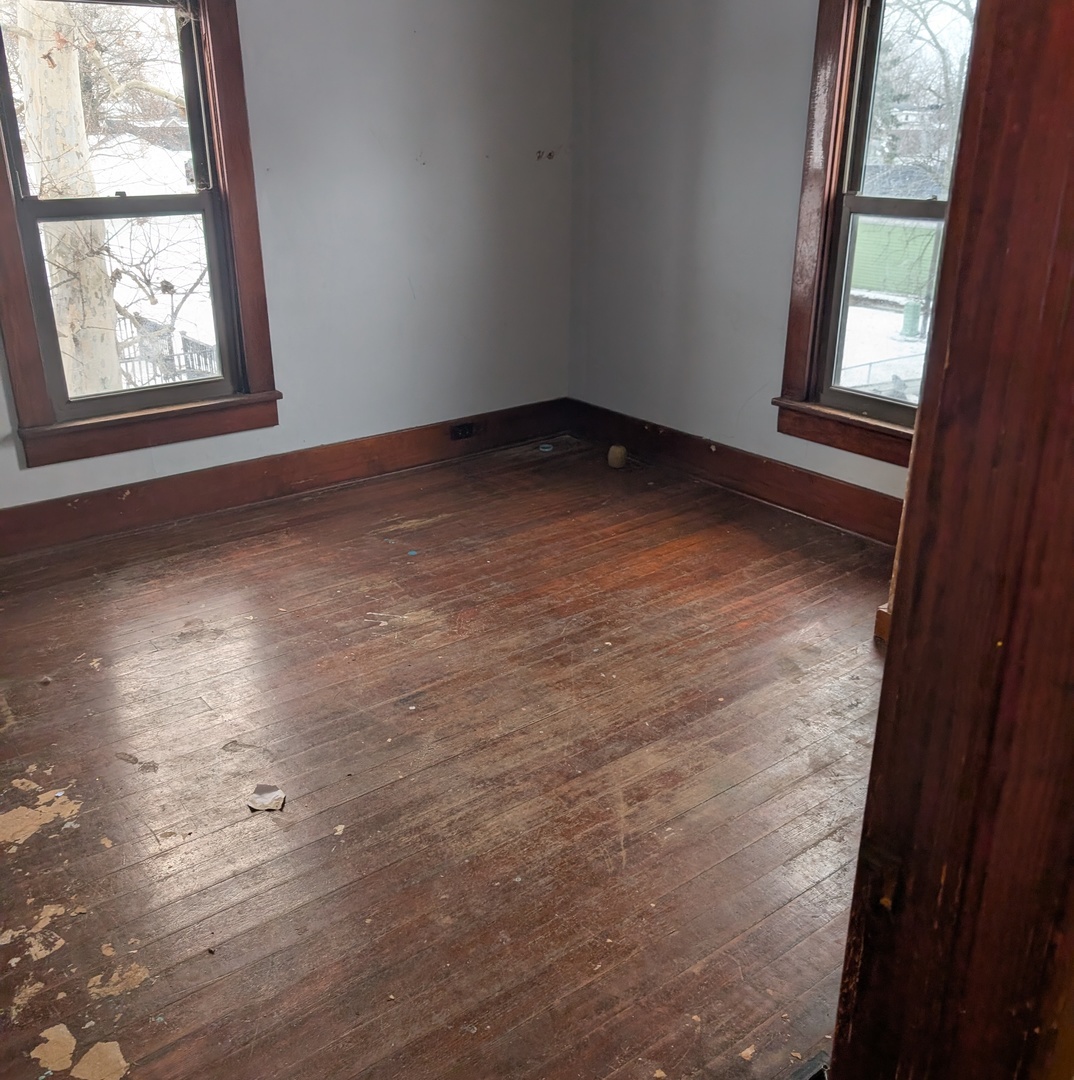 101 South Pine Street Buckley, IL 60918 - Photo 12 of 20 an empty room with wooden floor and windows