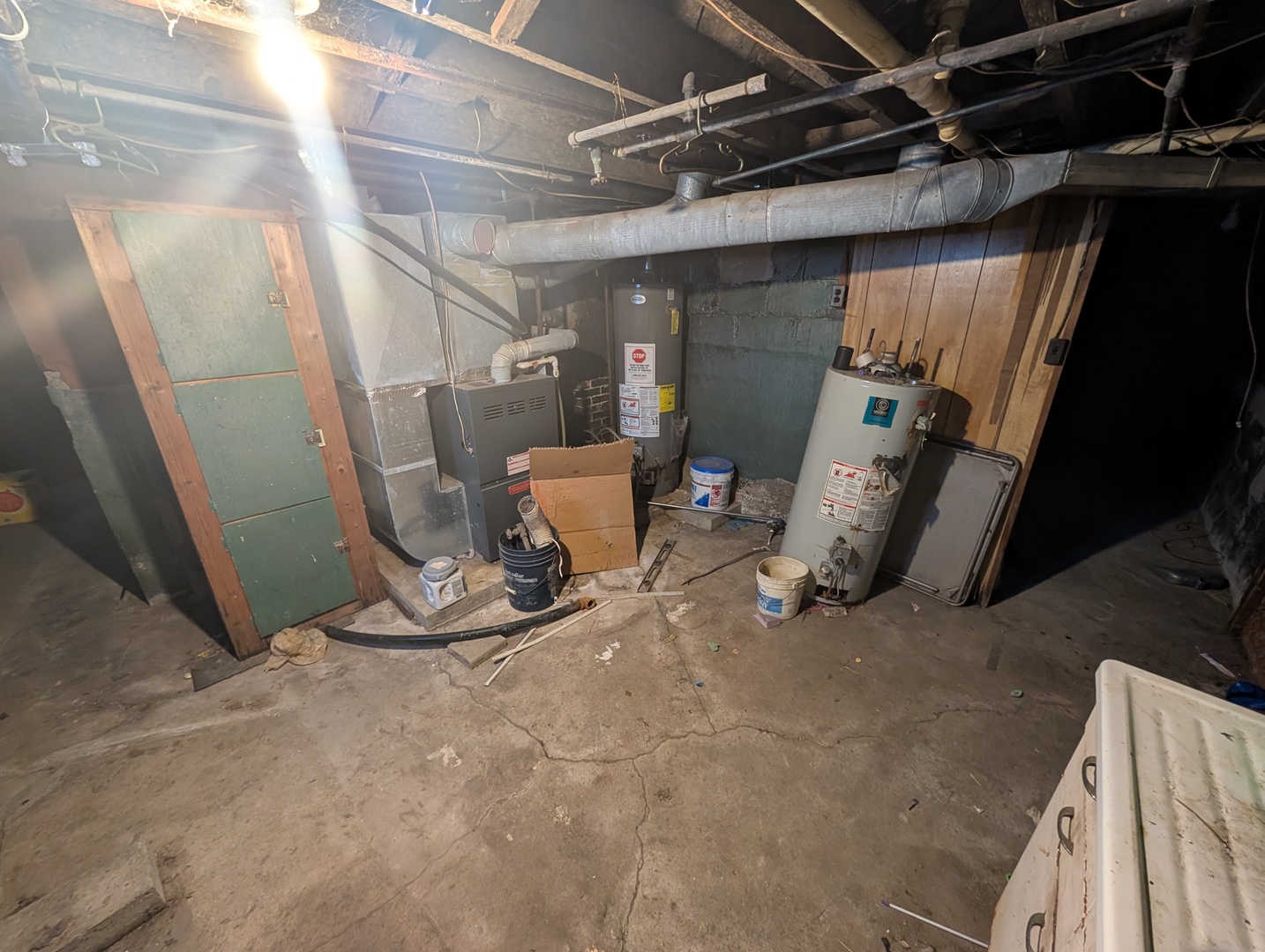 101 South Pine Street Buckley, IL 60918 - Photo 17 of 20 a view of a storage room with water heater and racks
