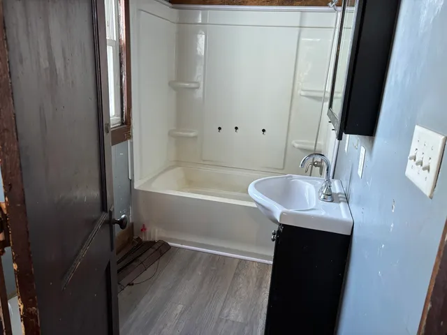 a bathroom with a sink and a tub