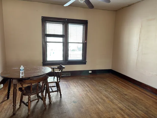 a view of a room with furniture window and wooden floor