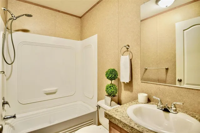a view of a livingroom with a chandelier fan