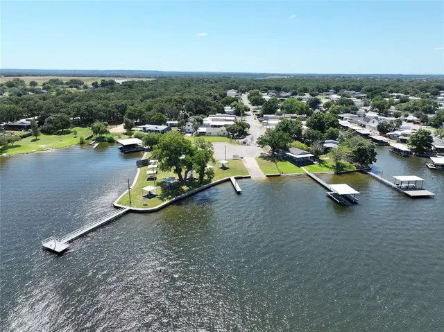 an aerial view of a house with a lake view