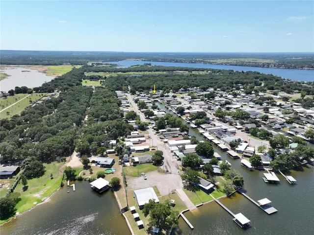 an aerial view of a house with a swimming pool