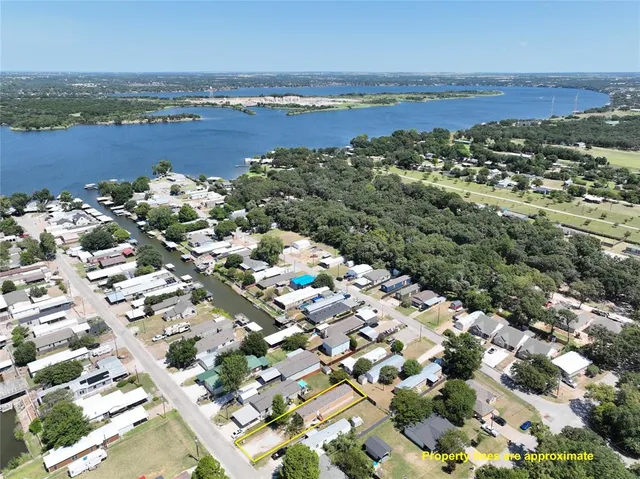 an aerial view of residential building and lake