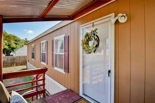 a view of two chairs in the balcony