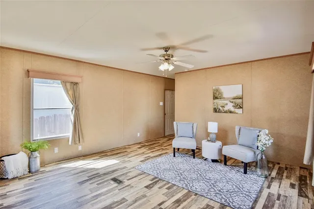 a large bedroom with a bed and furniture