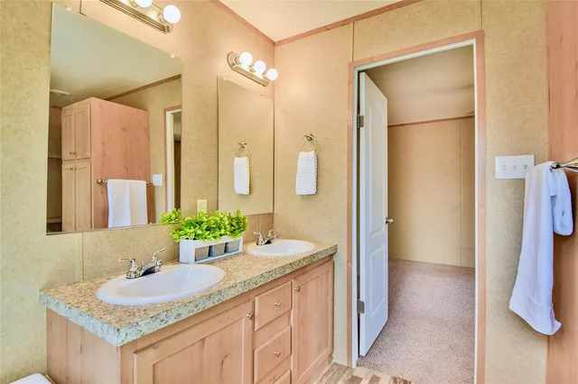 a large bedroom with a large bed and a large window