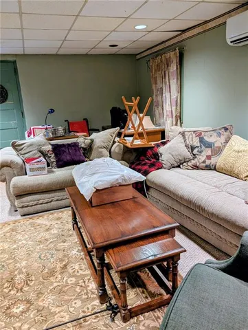 a living room with furniture and a rug