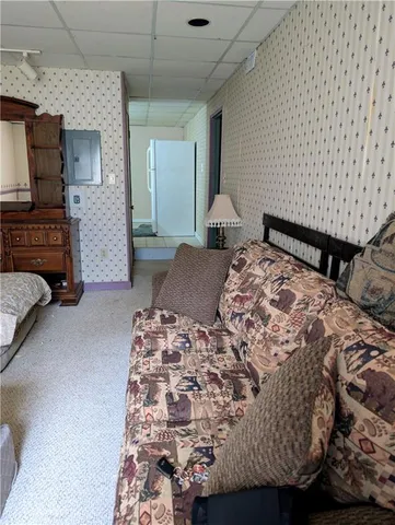 a bedroom with a bed and a couch