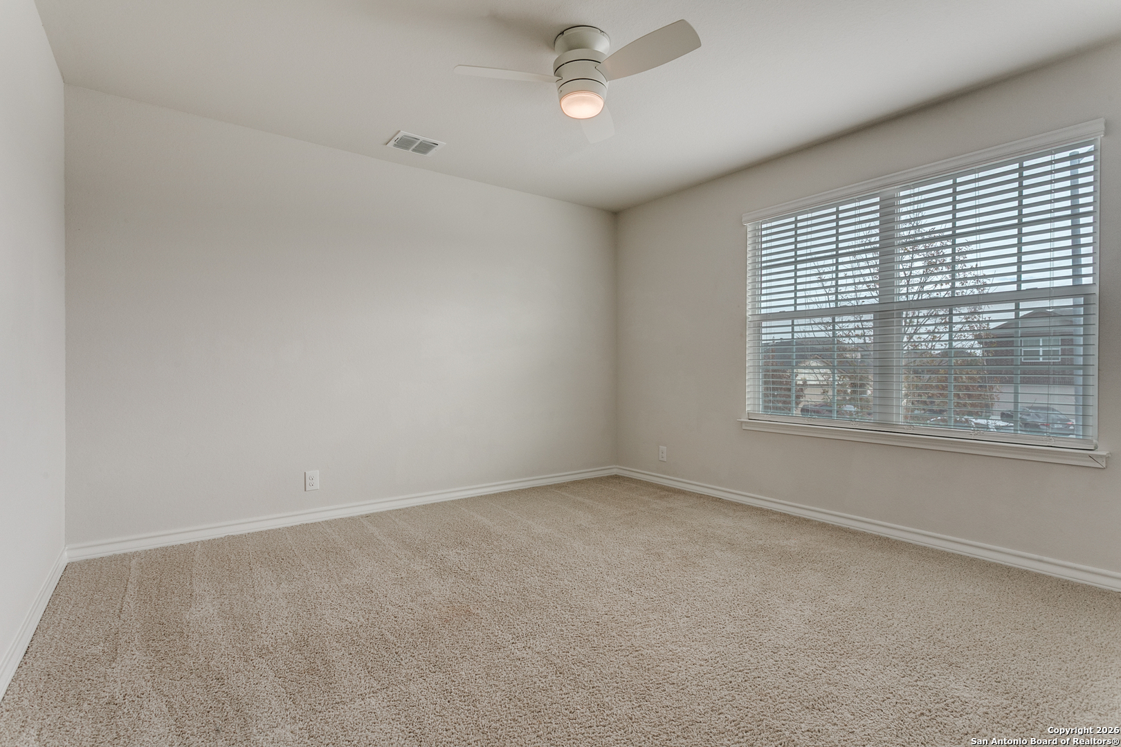 2615 Yaupon Ranch San Antonio, TX 78244 - Photo 20 of 25 a view of an empty room with a window