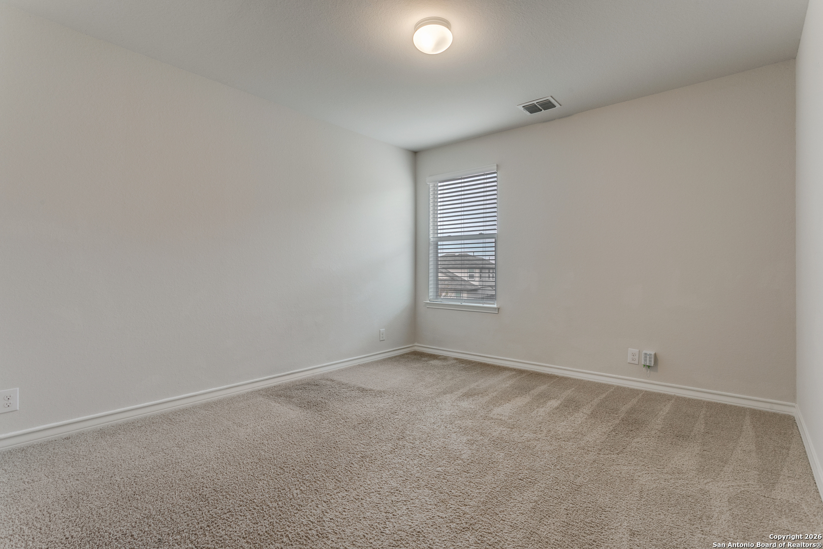 2615 Yaupon Ranch San Antonio, TX 78244 - Photo 21 of 25 an empty room with windows