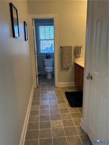 a bathroom with a toilet and a sink