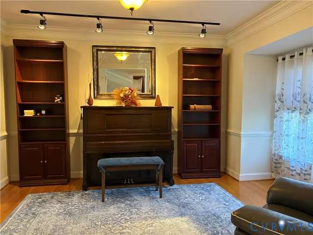 a living room with a furniture and a dresser