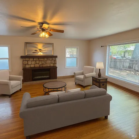 a living room with furniture and a fireplace