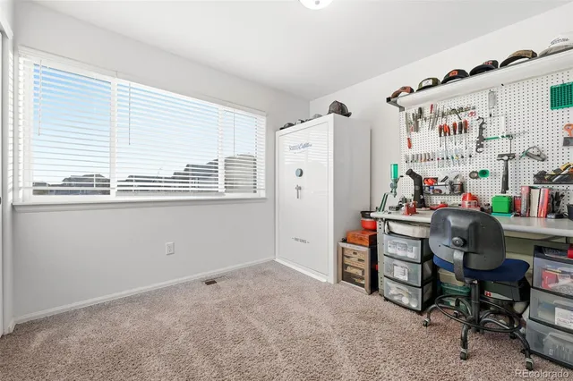 a room that has a bed and a window in it