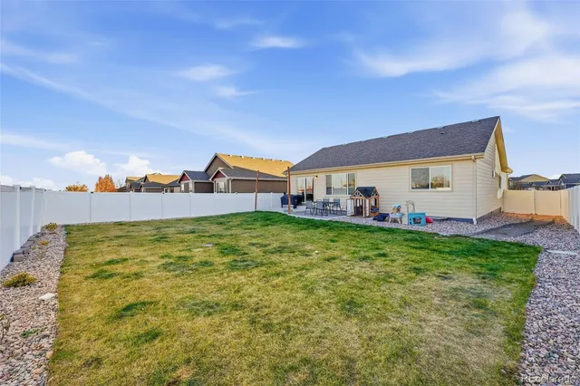 a view of a swimming pool with a yard