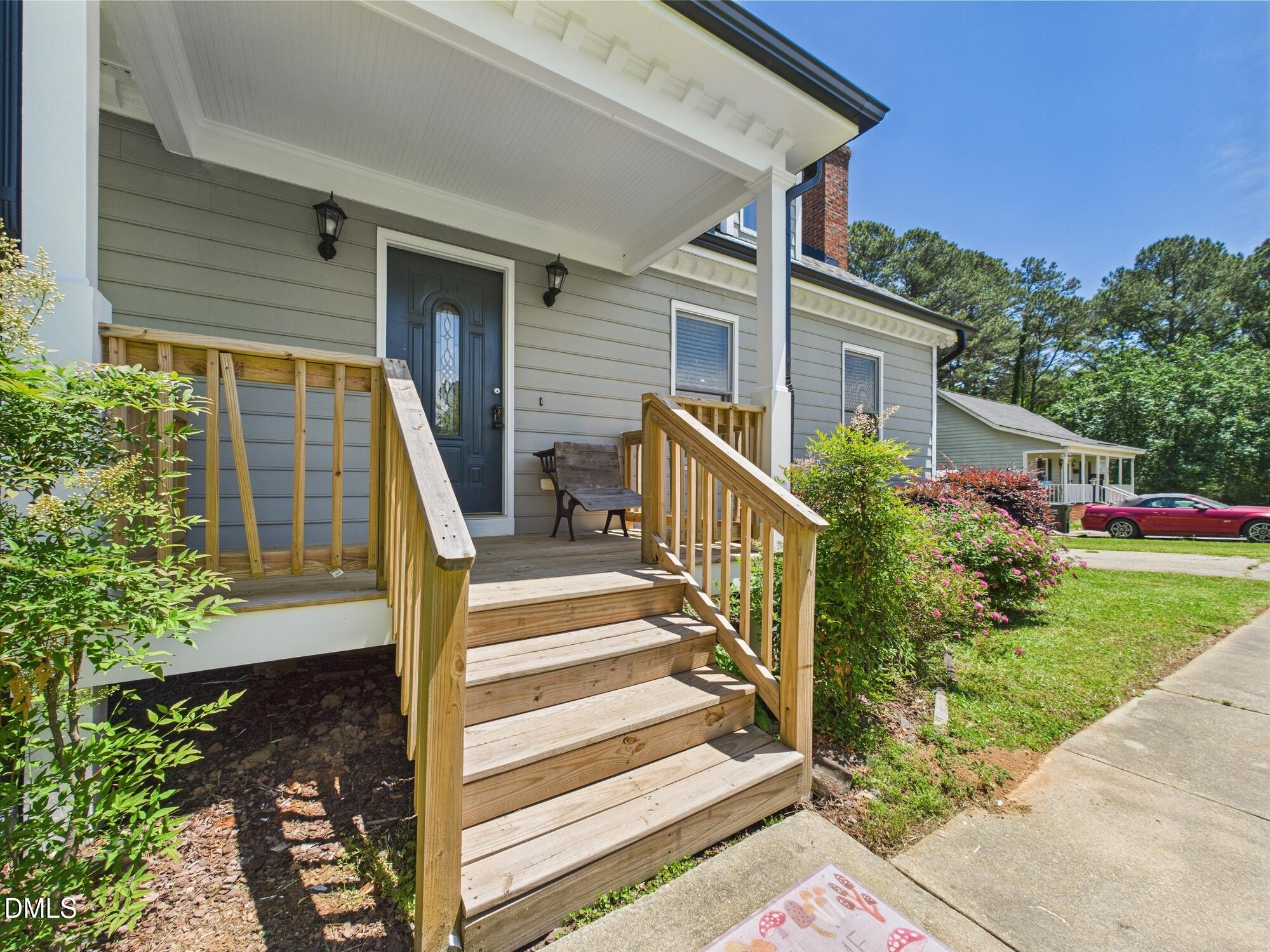 10917 Fanny Brown Road Raleigh, NC 27603 - Photo 7 of 54 a front view of a house with a yard balcony