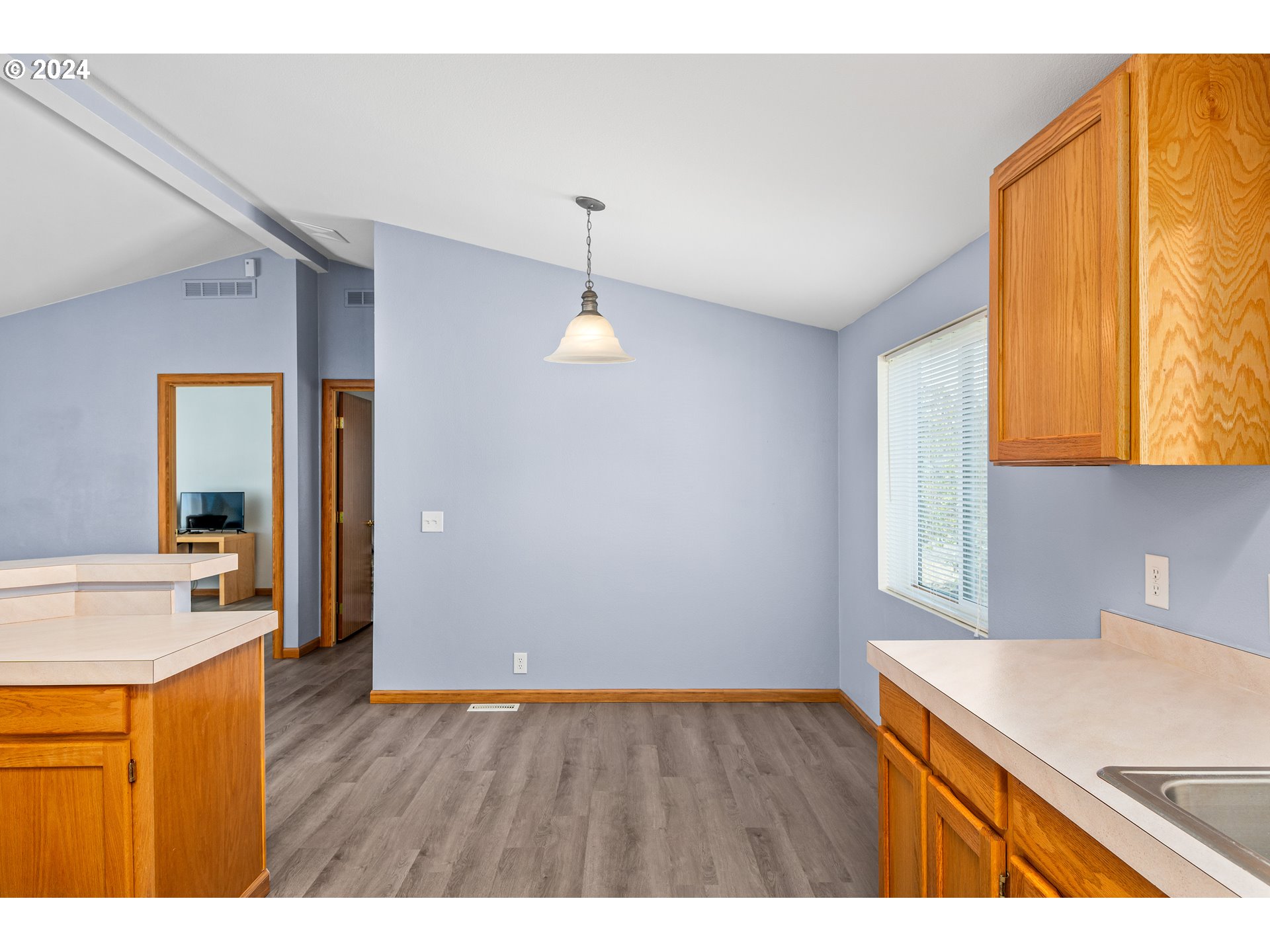 2606 Maia Loop Springfield, OR 97477 - Photo 12 of 29 a kitchen with a sink a refrigerator and window