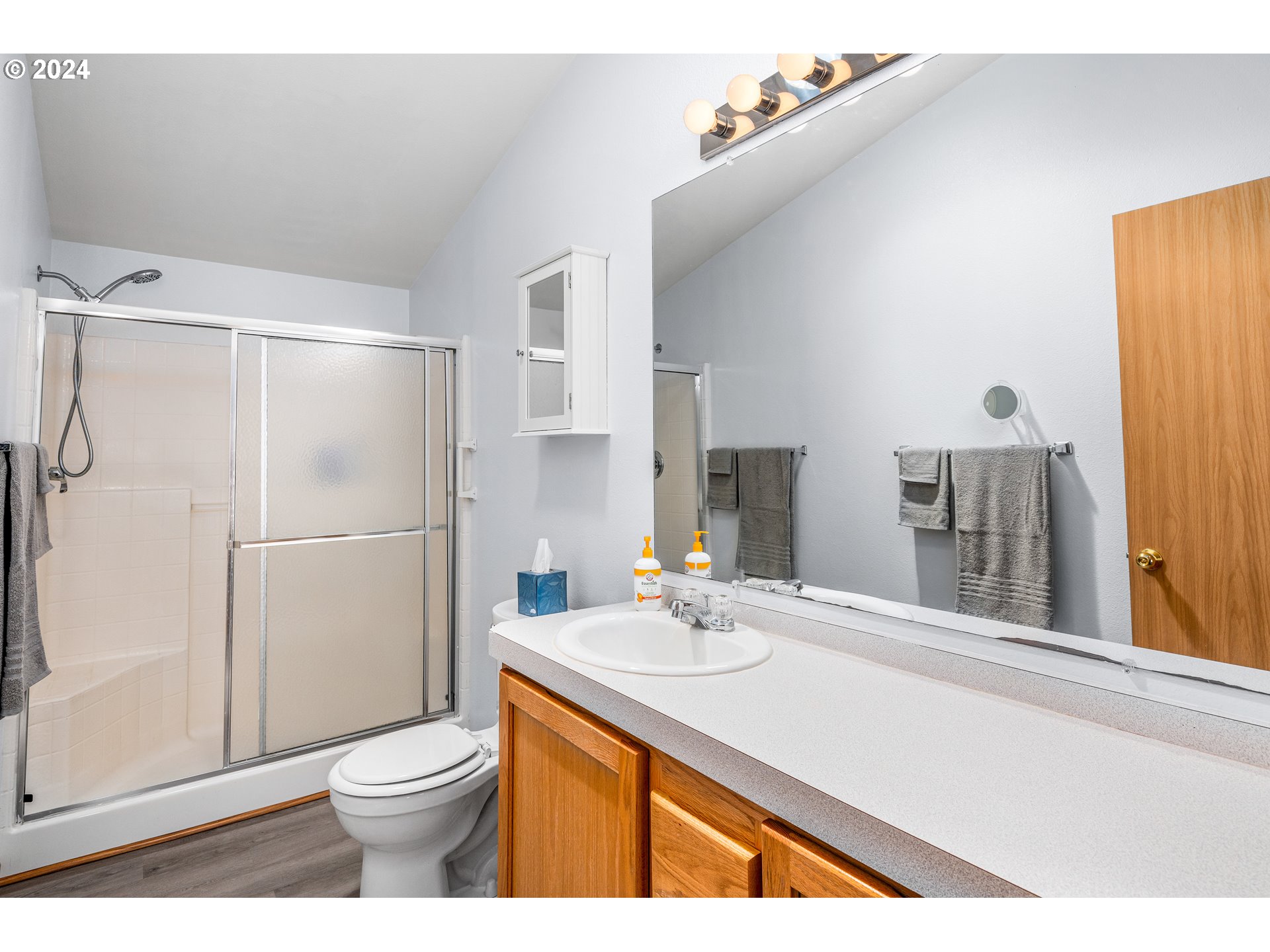 2606 Maia Loop Springfield, OR 97477 - Photo 16 of 29 a bathroom with a sink toilet and shower