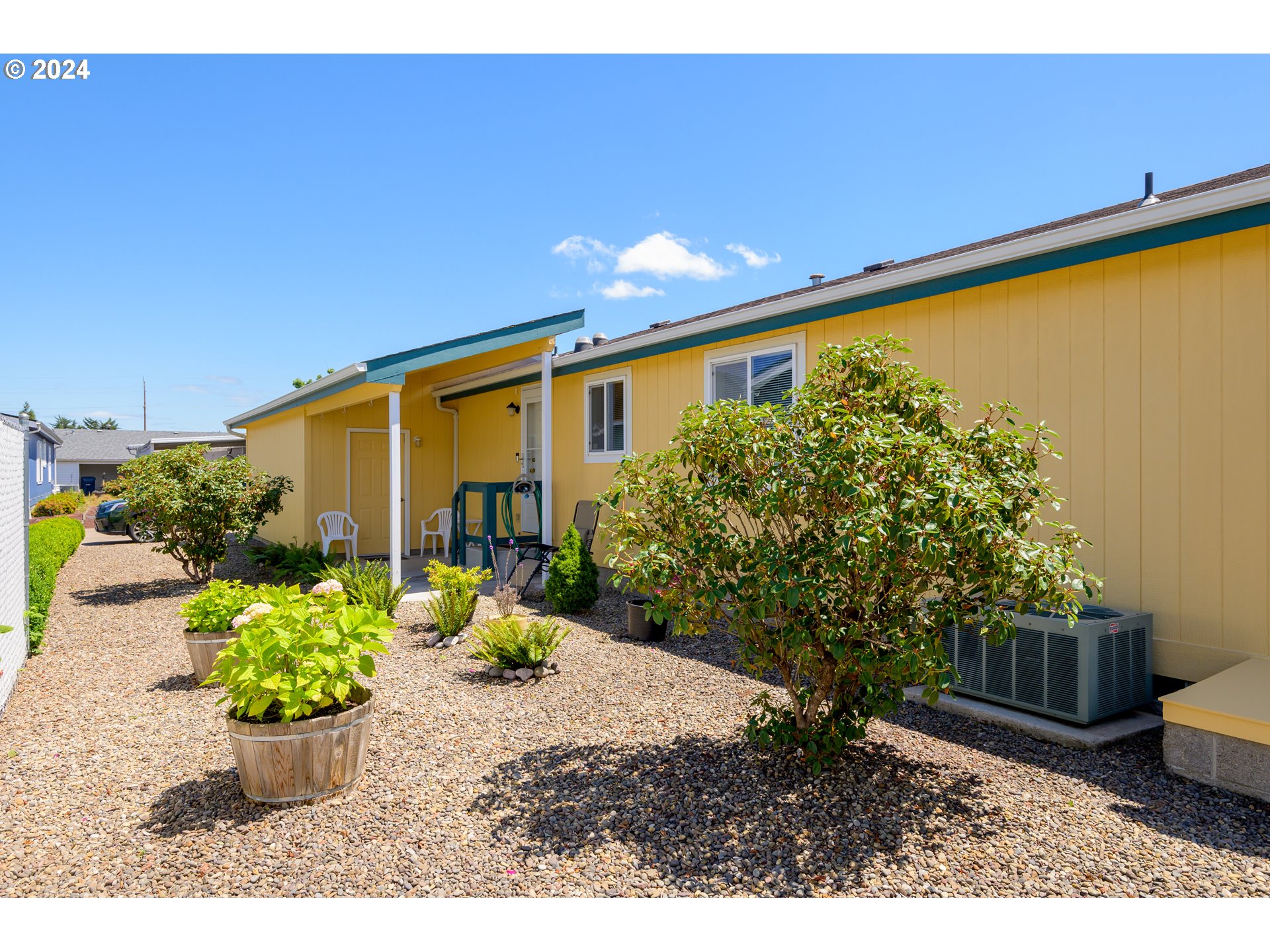 2606 Maia Loop Springfield, OR 97477 - Photo 27 of 29 a view of a backyard with plants and a patio
