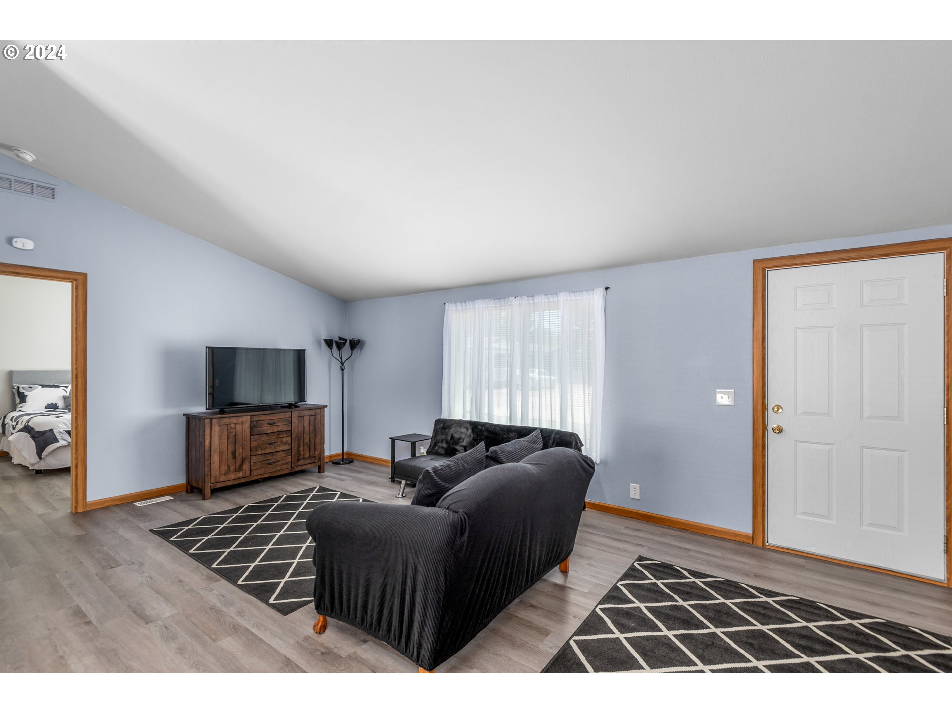 2606 Maia Loop Springfield, OR 97477 - Photo 5 of 29 a living room with furniture and a flat screen tv