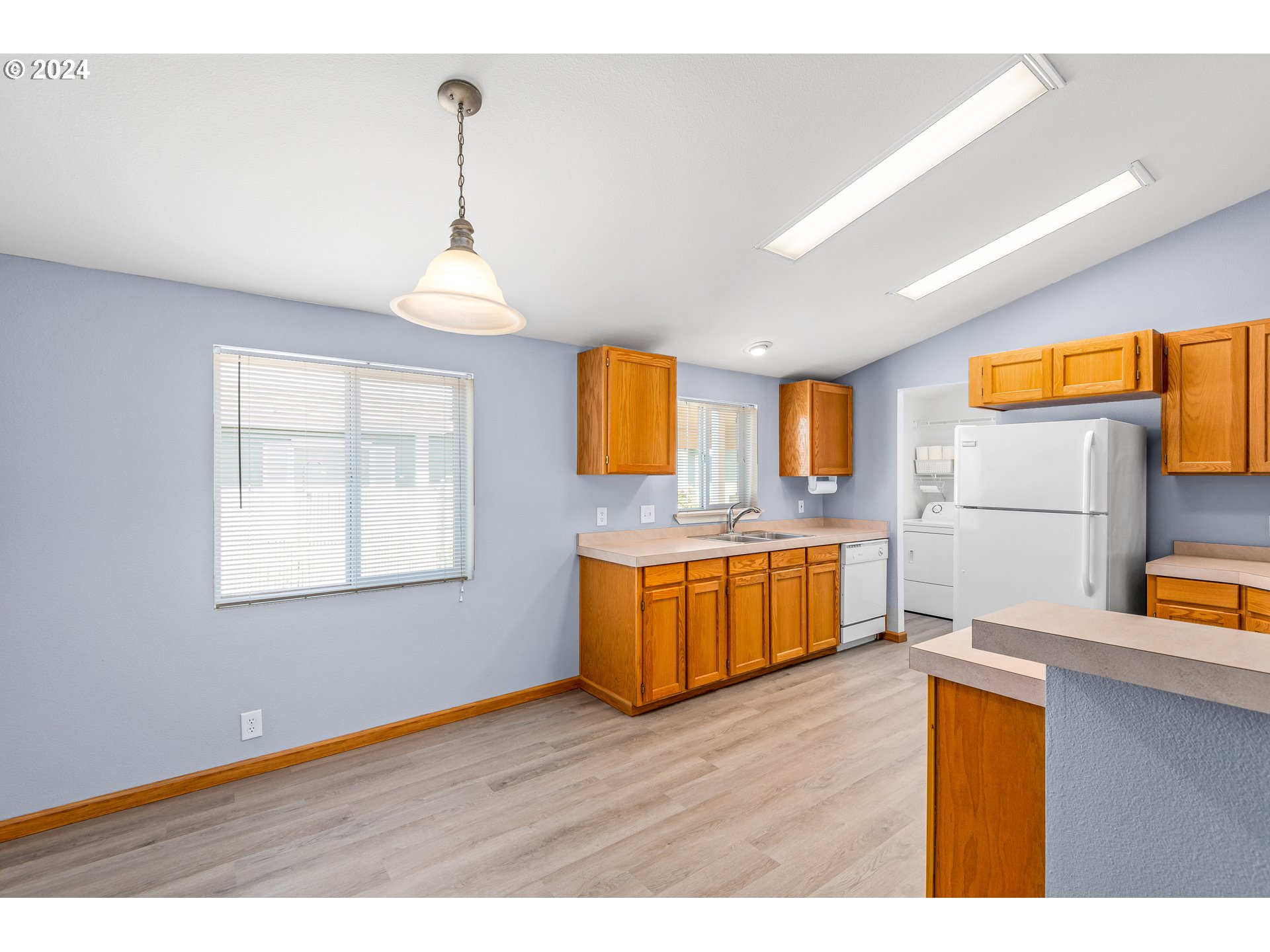 2606 Maia Loop Springfield, OR 97477 - Photo 8 of 29 a bedroom with a wooden floor and a window