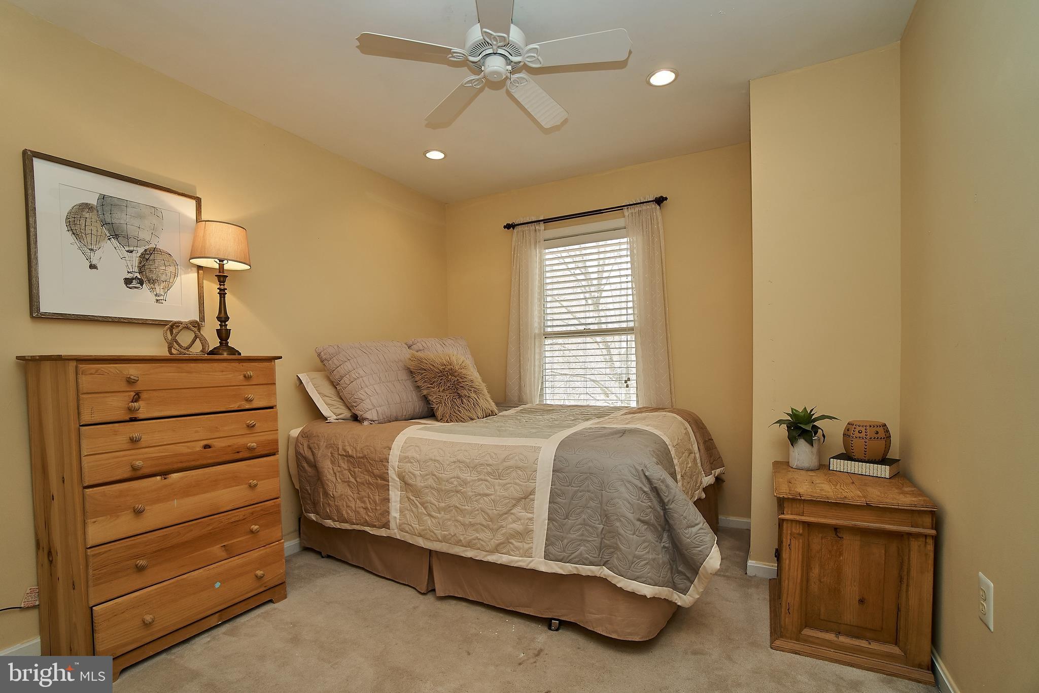 7214 Olde Lantern Way Springfield, VA 22152 - Photo 22 of 32 Bedroom 2 on upper level. Recessed lights. Fan.