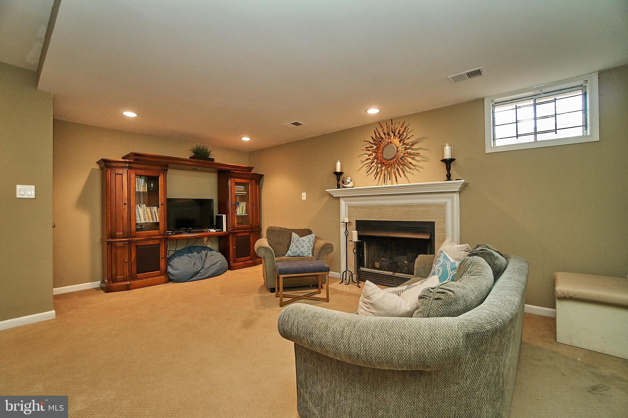 7214 Olde Lantern Way Springfield, VA 22152 - Photo 25 of 32 Cozy Family Room on lower level w/ gas fireplace.