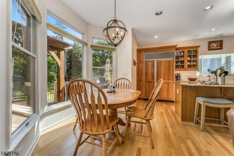 93 Bissell Road Lebanon, NJ 08833 - Photo 13 of 31 a view of a dining room with furniture large windows and wooden floor
