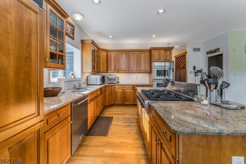 93 Bissell Road Lebanon, NJ 08833 - Photo 16 of 31 a large kitchen with stainless steel appliances granite countertop a sink and a stove