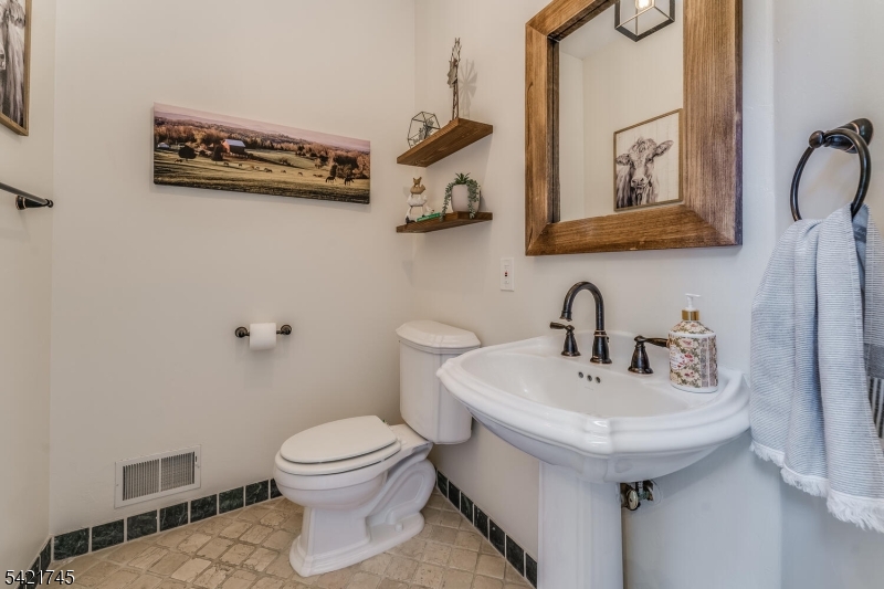 93 Bissell Road Lebanon, NJ 08833 - Photo 19 of 31 a bathroom with a toilet sink and mirror