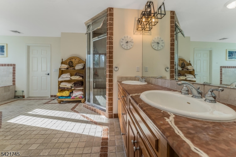 93 Bissell Road Lebanon, NJ 08833 - Photo 26 of 31 a bathroom with a sink a mirror and a shower
